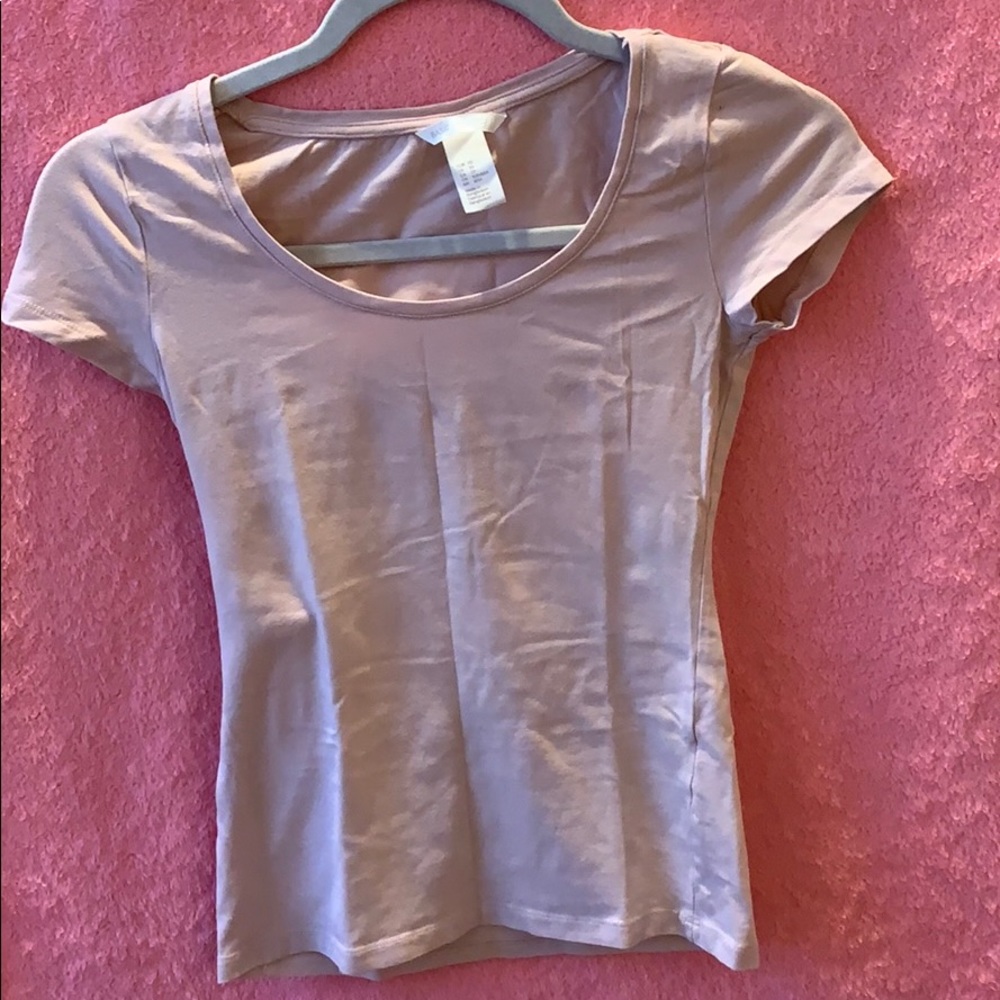 4 tops . 3 from H and M. 1 from Caution the wind.